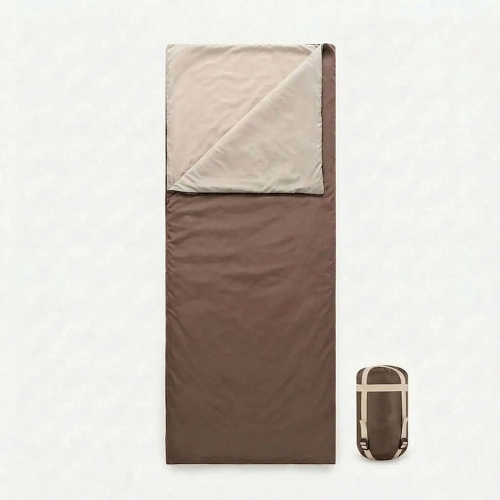 Brown summer sleeping bag, lightweight and comfortable for outdoor recreation and travel.