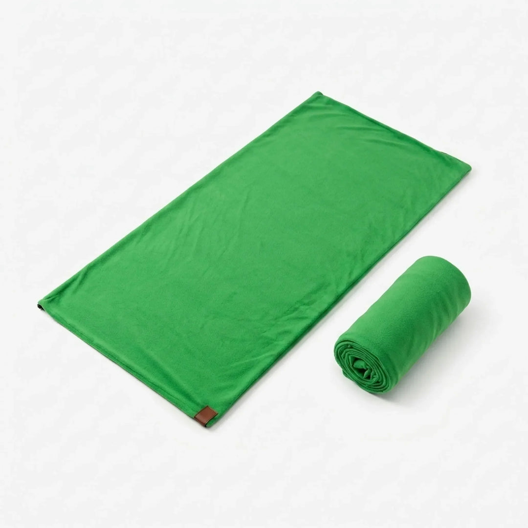 Green lightweight envelope sleeping bag liner. Essential for hygienic camping & travel comfort.