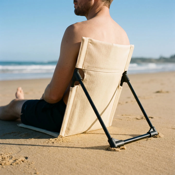 Lightweight portable folding floor chair for outdoor comfort, perfect for camping, beach, or picnics.