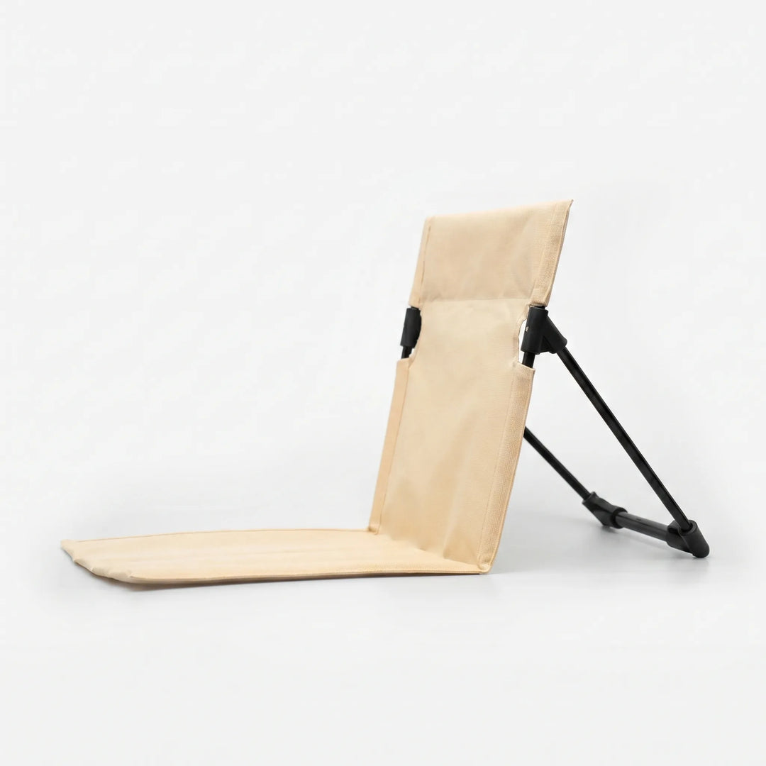 Unisex folding camping chair with back support, ideal for ground seating at campsites and outdoor events.
