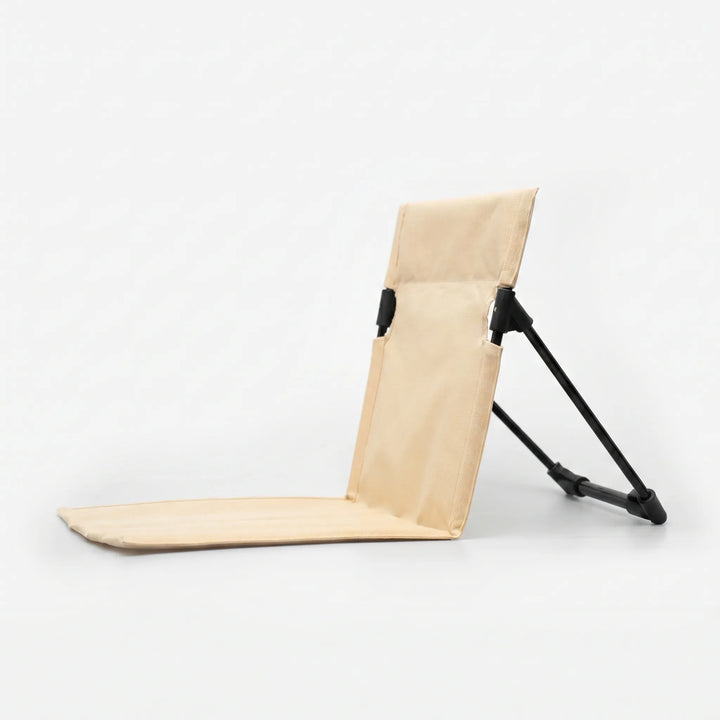 Unisex folding camping chair with back support, ideal for ground seating at campsites and outdoor events.