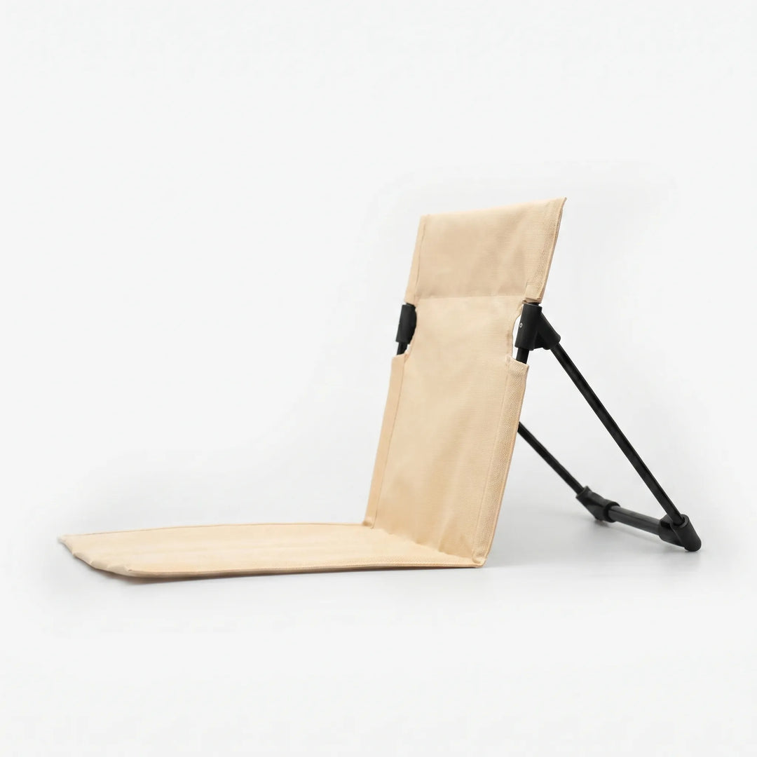 Unisex travel floor chair, ultra-portable and lightweight, designed for comfortable outdoor ground seating.
