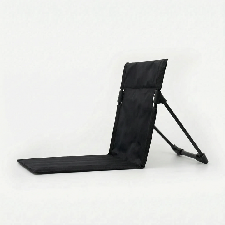 Ergonomic folding floor chair with strong back support, ensuring comfortable ground seating for all outdoor activities.