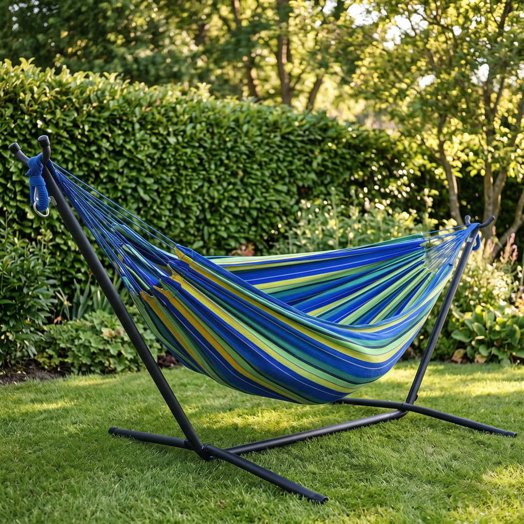 Striped portable garden hammock for ultimate outdoor relaxation. Perfect for backyard lounging & travel comfort.