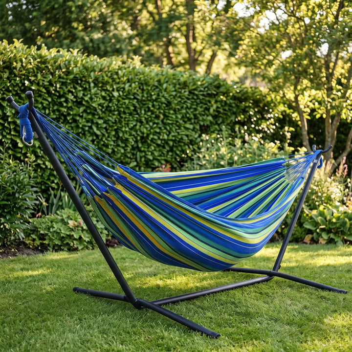 Striped portable garden hammock for ultimate outdoor relaxation. Perfect for backyard lounging & travel comfort.