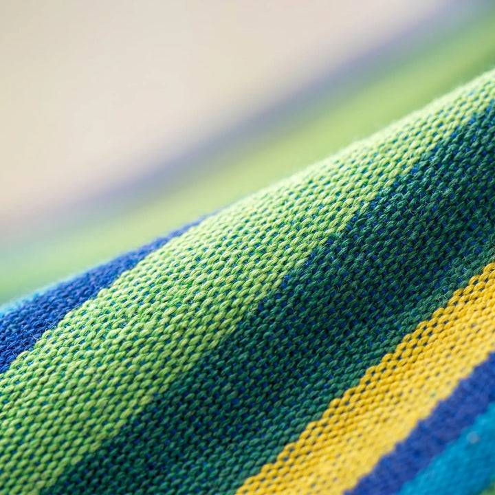 Vibrant striped portable outdoor hammock for backyard, garden, or camping. Lightweight & comfortable for travel.