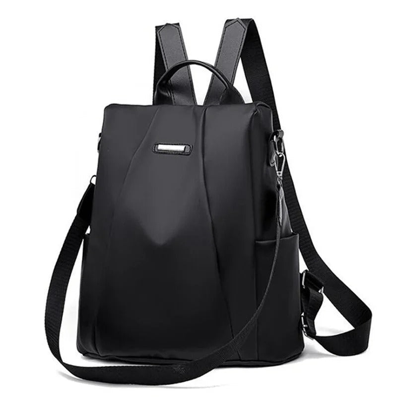 Lightweight water-resistant nylon women's backpack, convertible to shoulder or crossbody, in a minimalist design