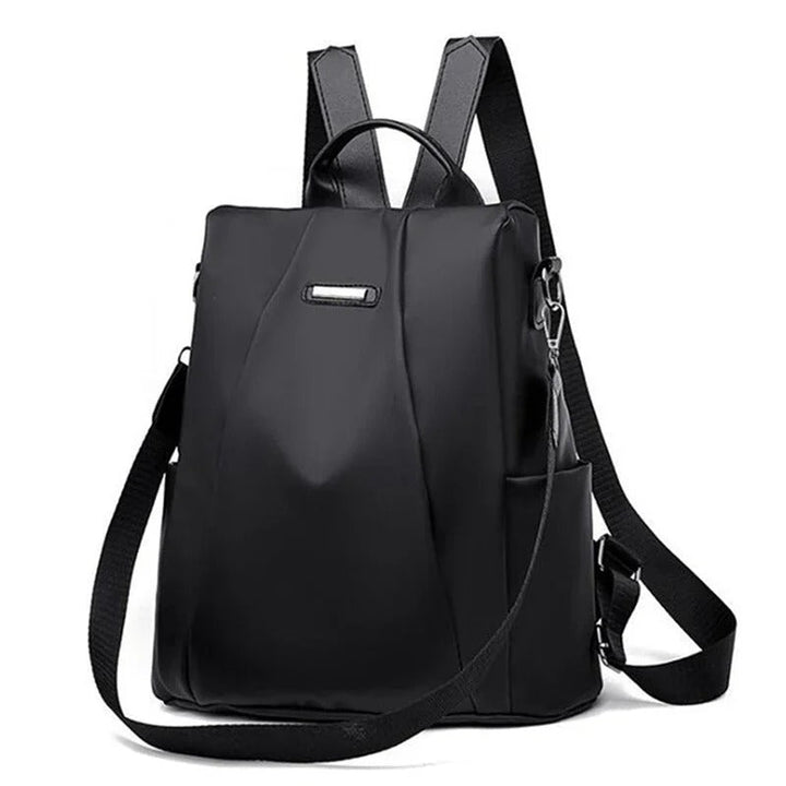 Lightweight water-resistant nylon women's backpack, convertible to shoulder or crossbody, in a minimalist design