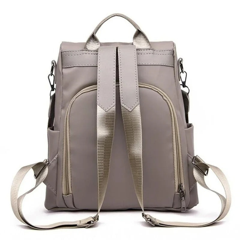 Versatile water-resistant nylon backpack for women, shown in its multi-way configuration, minimalist design