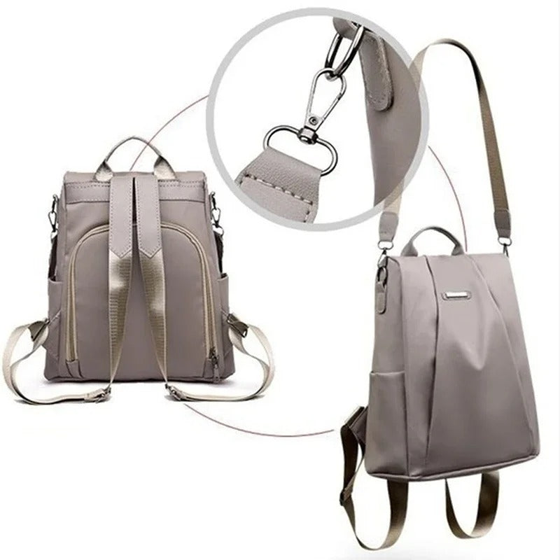 Close-up of a women's lightweight water-resistant nylon backpack, highlighting the material and zipper details