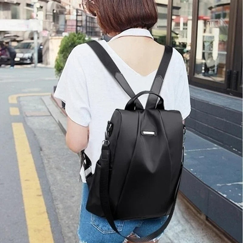 Everyday carry women's backpack, lightweight and water-resistant nylon, convertible for shoulder or crossbody