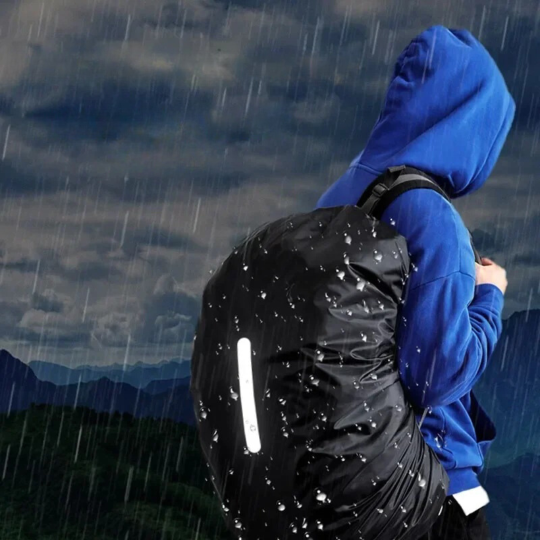 Water beading off the waterproof surface of a backpack rain cover, illustrating its excellent rain protection.