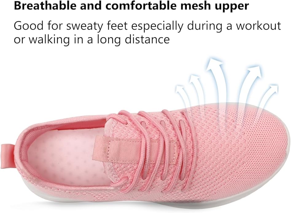 Side view of a white women's sport sneaker with pink accents, great for workouts