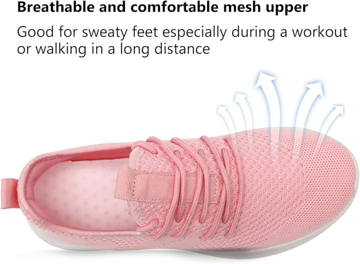 Side view of a white women's sport sneaker with pink accents, great for workouts