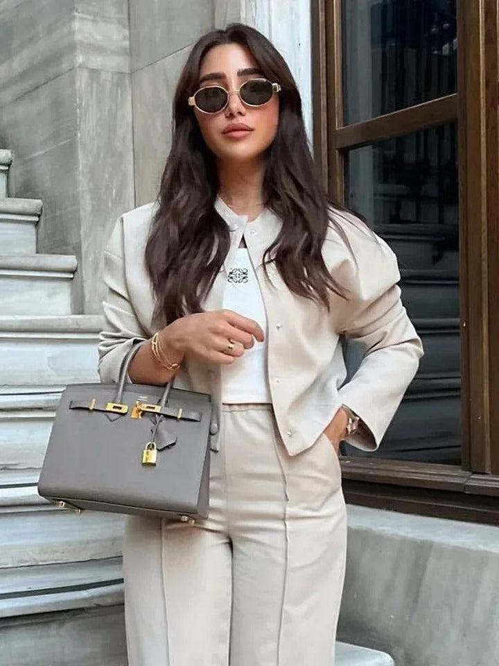 Summer outerwear: women's lightweight bomber jacket, casual elegant with a modern stand collar.