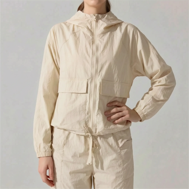 Versatile women's hooded activewear jacket, lightweight & perfect for sports, outdoor adventures, or casual use.
