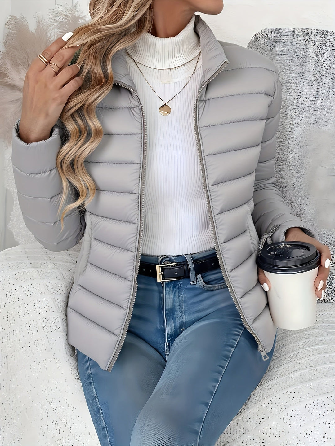 Comfortable women's lightweight quilted jacket with a stand collar and zip-up front. Essential transitional fall outerwear.