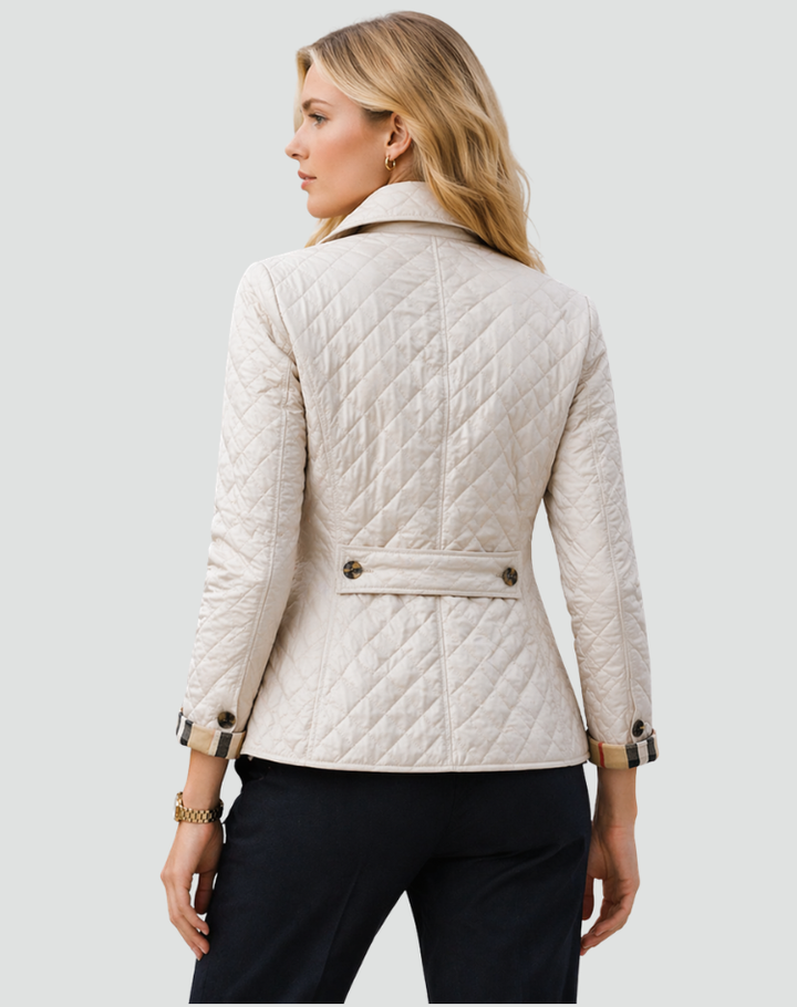 Women's quilted fall jacket, lightweight with a sophisticated structured collar. Button-front design.