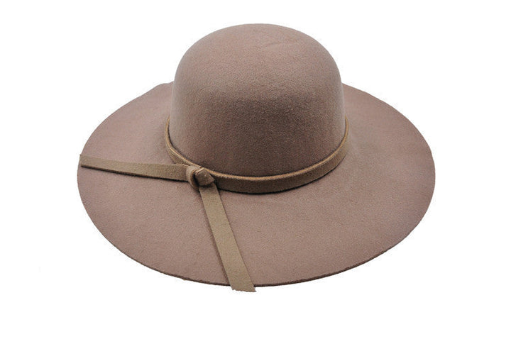 Foldable navy blue women's bucket hat, ideal for summer sun protection and easy packing