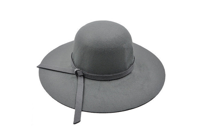 Woman wearing a fashionable lightweight summer bucket hat, demonstrating casual style