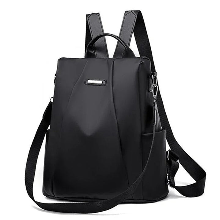 Lightweight women's water-resistant nylon backpack for travel & everyday use. Multi-way carry: shoulder, crossbody, handbag.