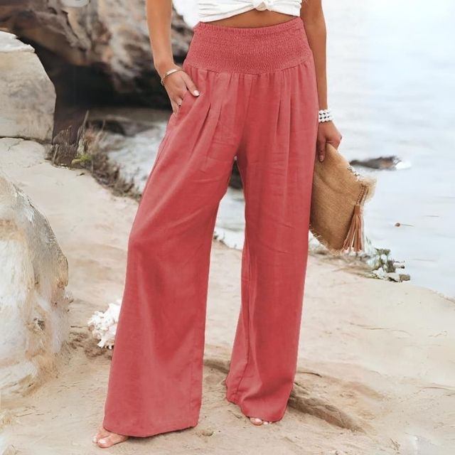 Lightweight wide-leg linen blend trousers for women, featuring a flowing silhouette and breathable fabric.