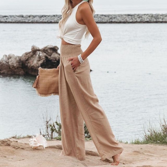 Women's breathable wide-leg linen blend trousers in ecru, ideal for spring and summer comfortwear.