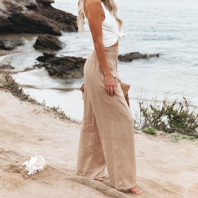 Casual fashion women's wide-leg trousers made from a soft linen blend, showcasing a relaxed fit.