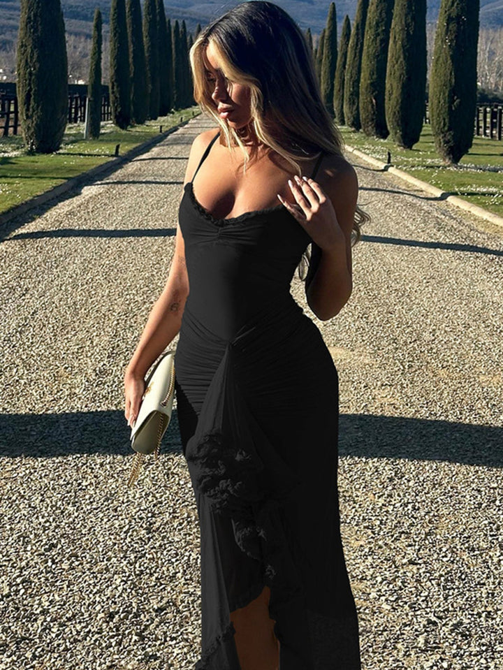 Picture of a women's flowing spaghetti strap maxi dress with cascading ruffles