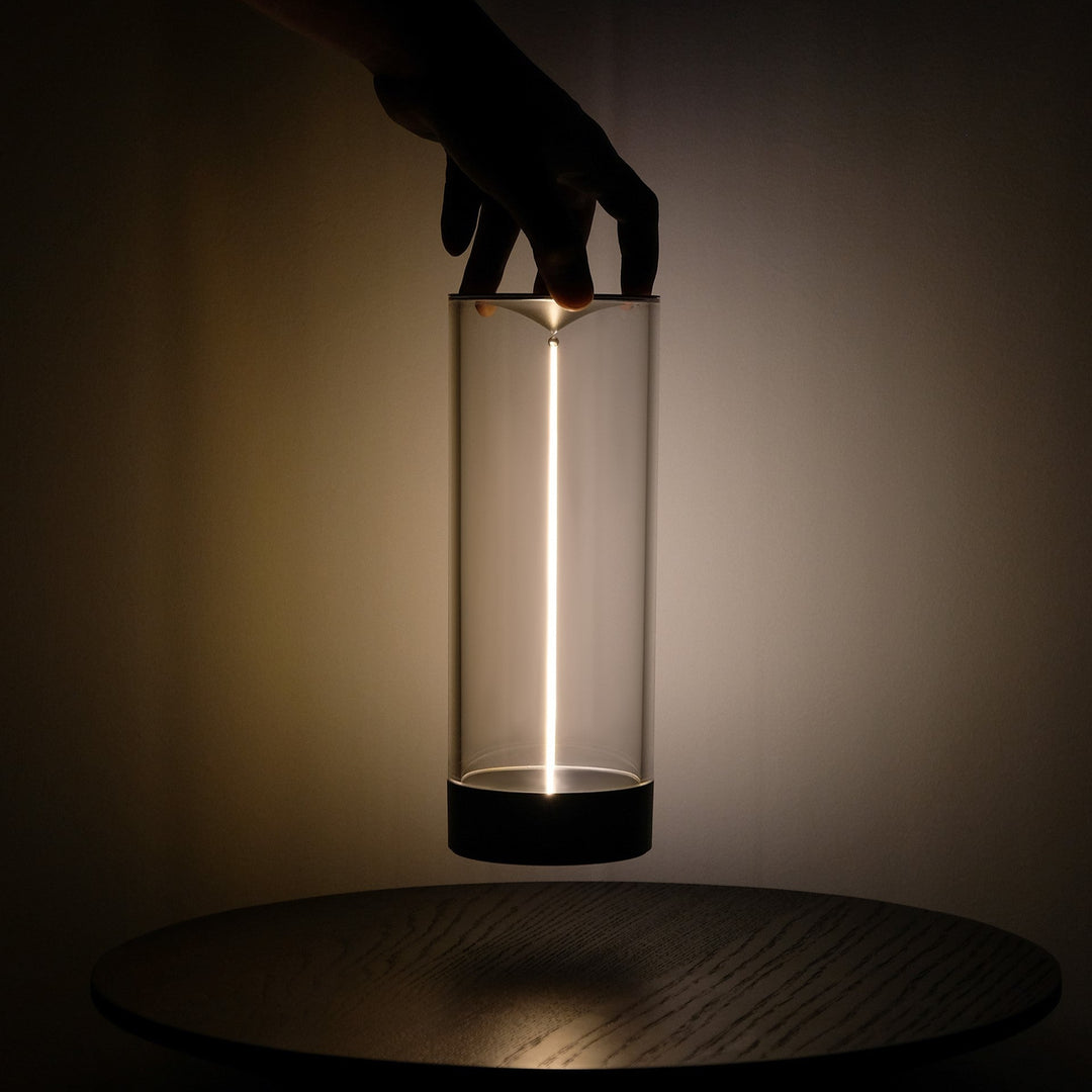 LumenFlow Wireless Mood Lamp with magnetic light strand, glowing warm amber light on a modern table
