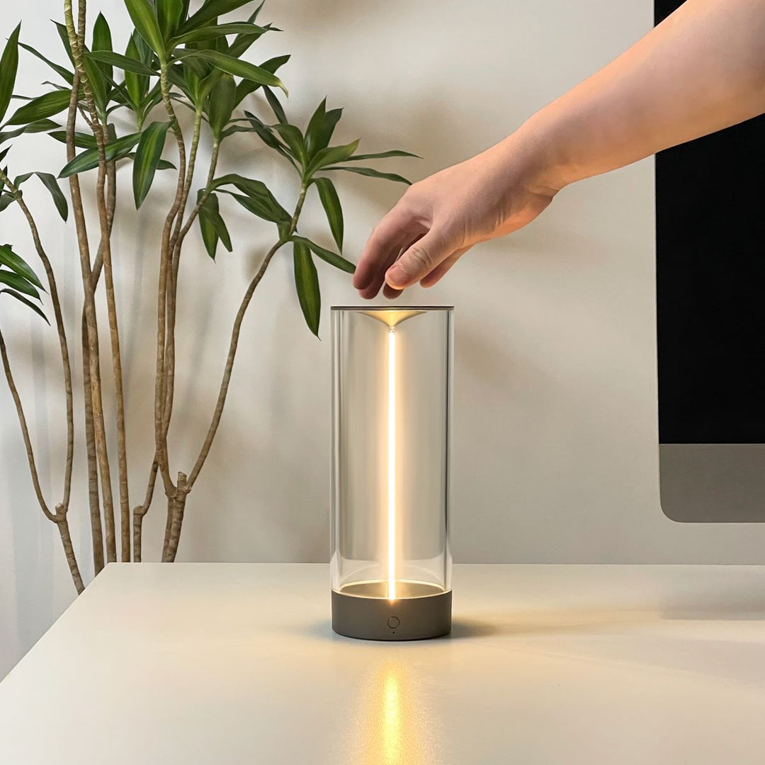 Unisex LumenFlow wireless mood lamp in a minimalist setting, emphasizing its clean aesthetic