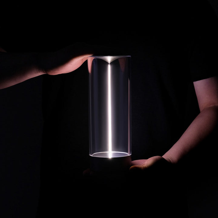Unisex LumenFlow mood lamp with magnetic light, showcasing its sleek design on a bedside table
