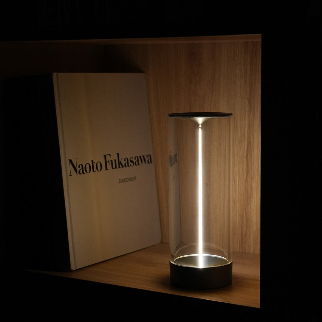 Modern LED table lamp, LumenFlow, providing ambient wireless lighting in a contemporary living room