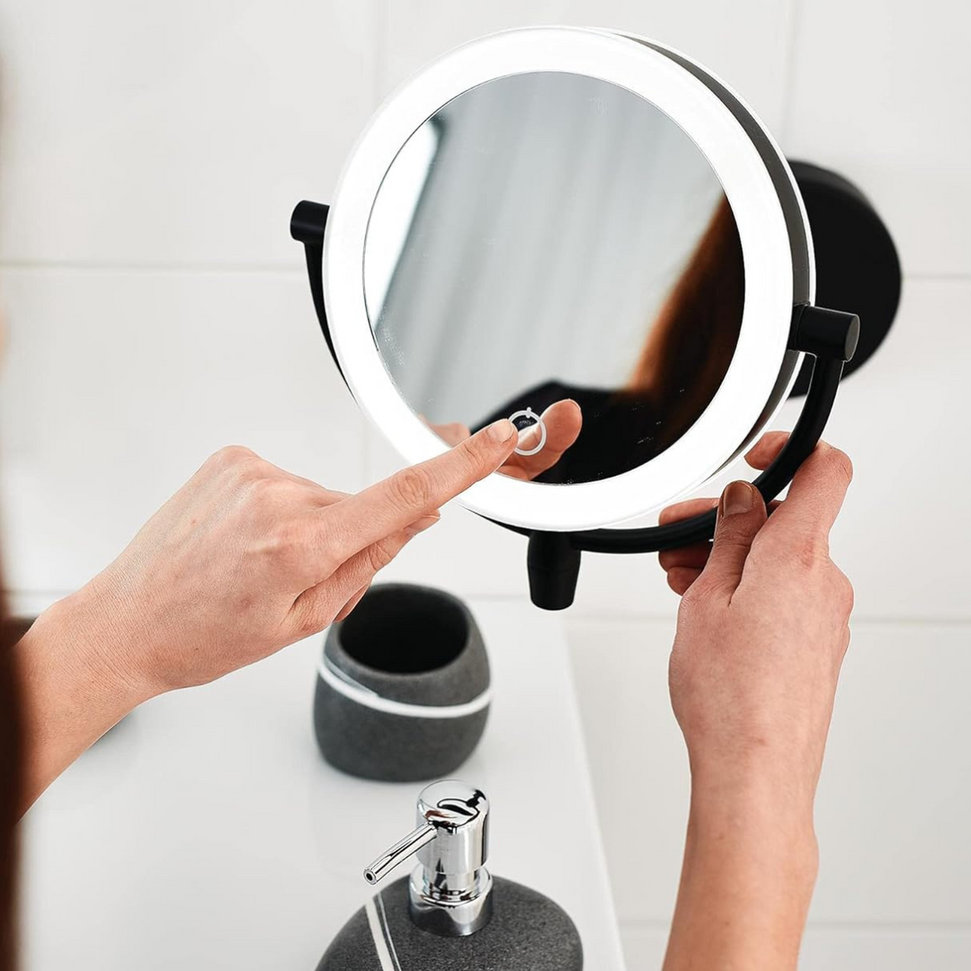 Portable LumiAura vanity mirror with adjustable brightness, ideal for detailed makeup application.