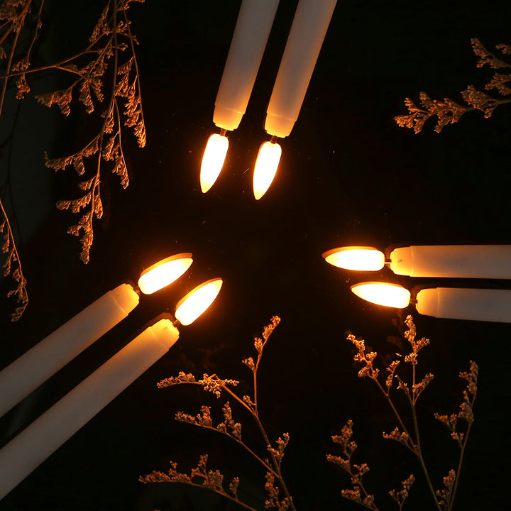 Living room decorated with LumiCandle flameless LED standing candles, creating cozy ambiance