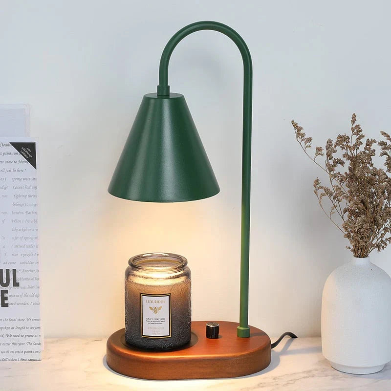 A stylish gold candle warmer lamp with a dimmable light, perfect for flameless fragrance diffusion and home decor.