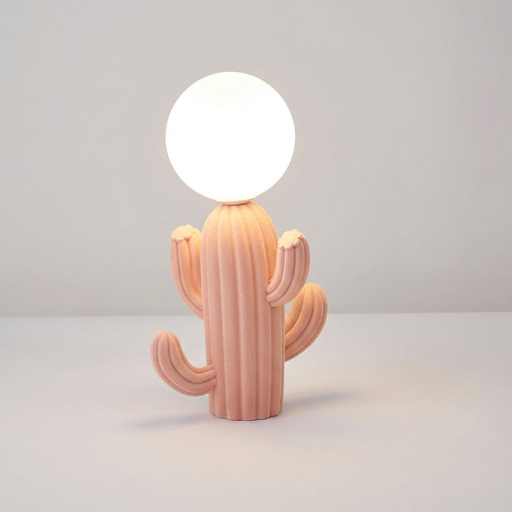 Decorative cactus table lamp by Luminacti, featuring a soft plush body and a round glass sphere, ideal for mood lighting