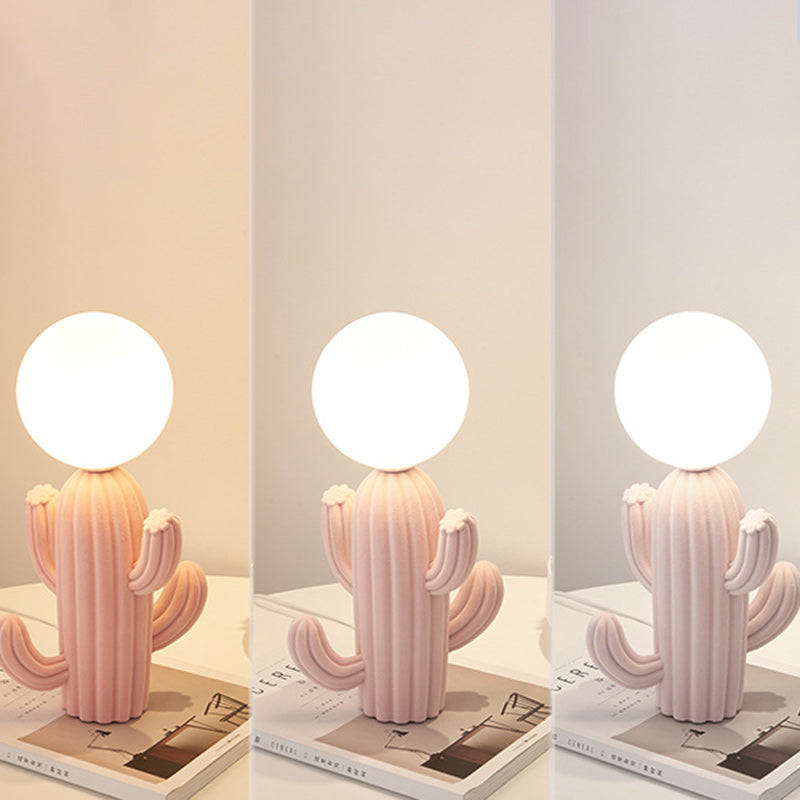 Luminacti Cactus Table Lamp, a plush novelty lamp with a glass globe, providing warm decorative lighting for any room