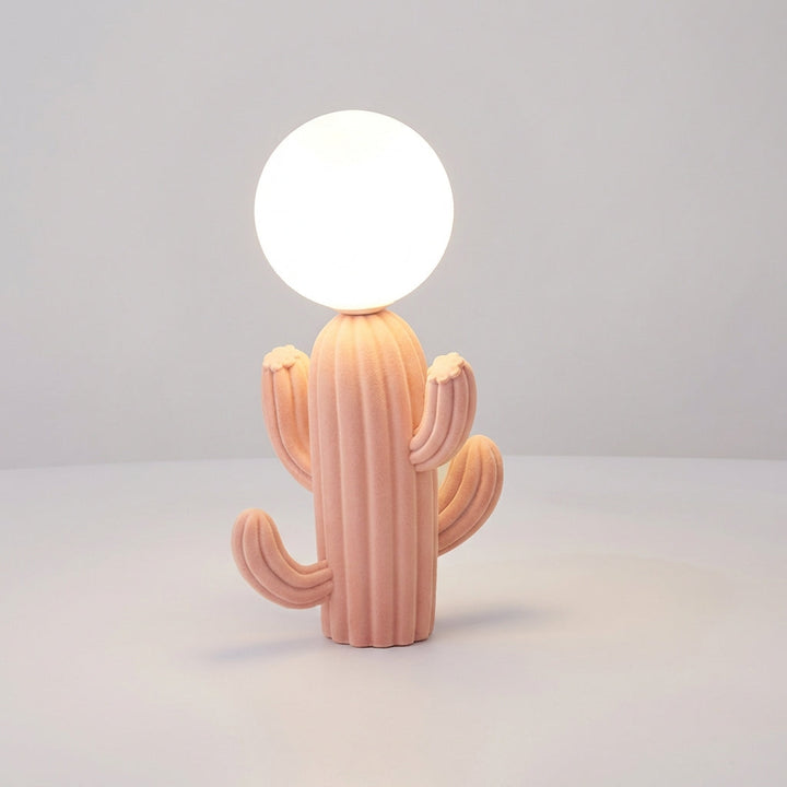 Green plush cactus table lamp with a clear glass globe by Luminacti, a stylish and unique gift for home decor