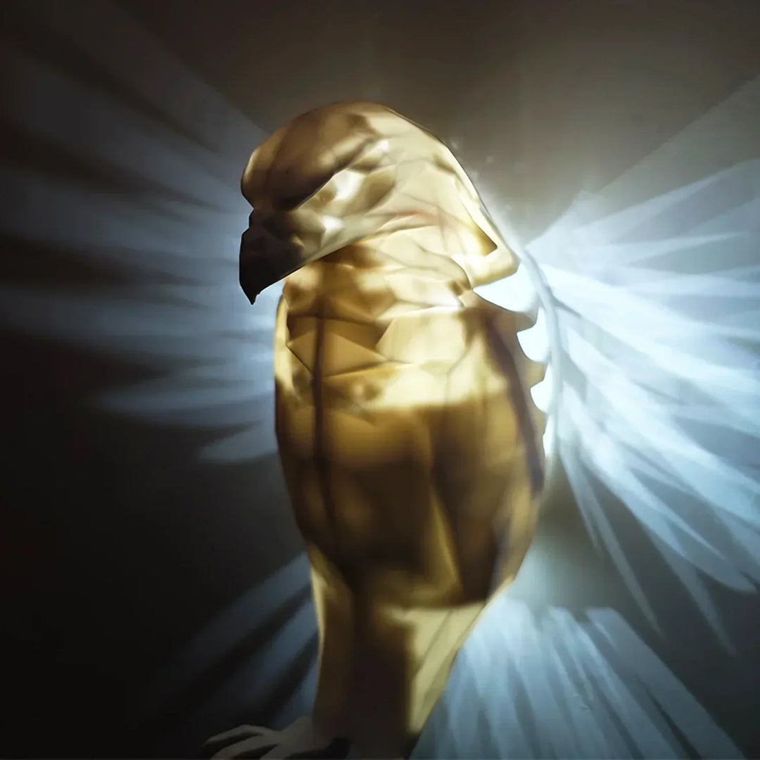Collection of LumaWings wall lamps in various sizes arranged on a dark wall, creating a glowing art display.