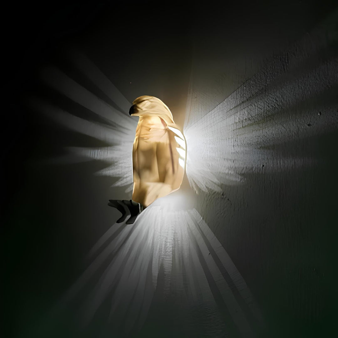 Detail of the translucent resin wings of the LumaWings wall lamp, showcasing light diffusion.