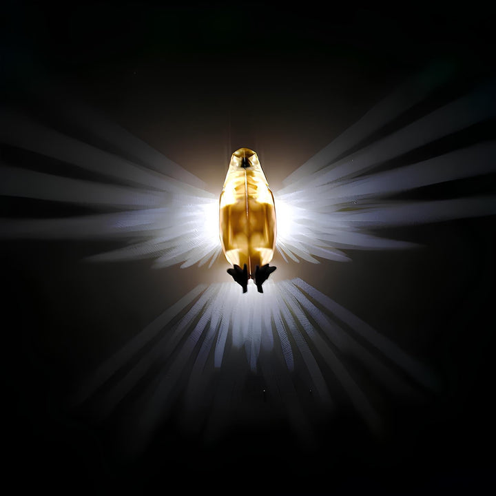 LumaWings LED wall lamp in a bedroom, casting a warm glow, unique decorative lighting piece.