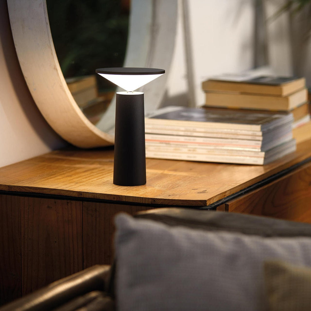 Outdoor-ready LumoFlex portable lamp, offering dimmable LED lighting for various modern environments.