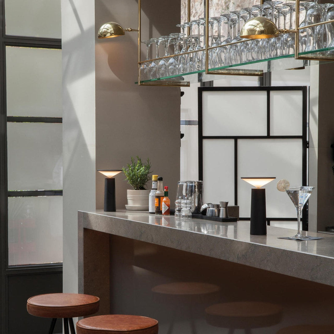LumoFlex portable table lamp, highlighting its dimmable LED functionality for modern spaces and decor.