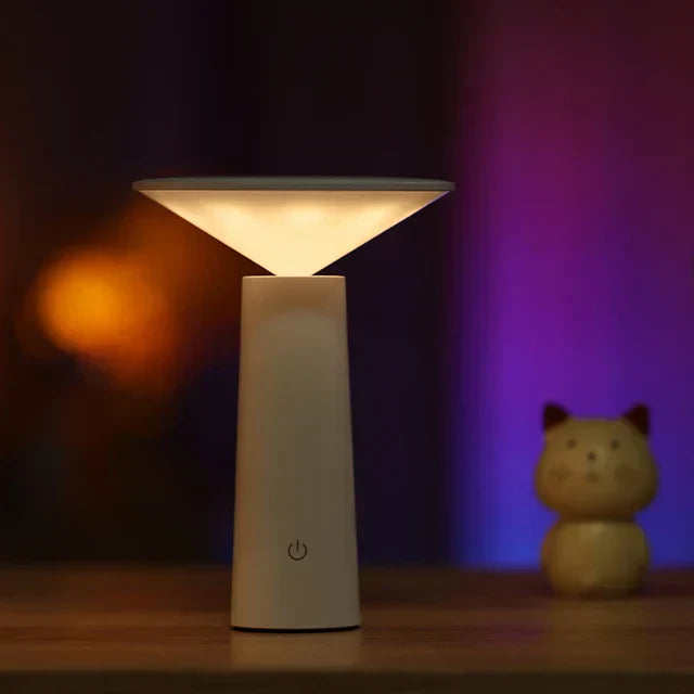 Portable LumoFlex dimmable LED lamp, ideal for adding modern lighting to outdoor patios or indoor tables.