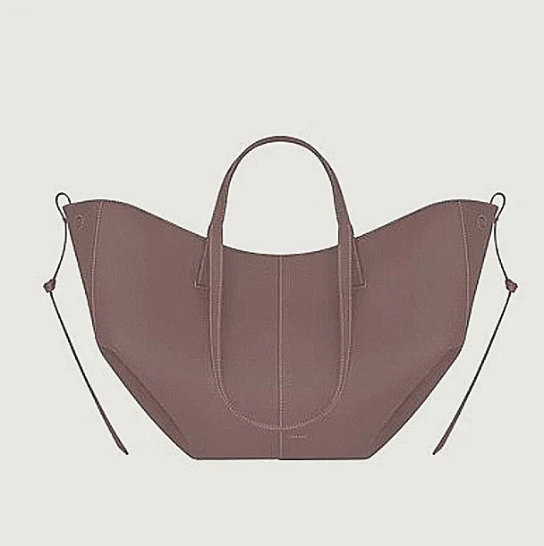 Women's leather handbag, a luxury shoulder bag, elegant and stylish daily accessory for errands.