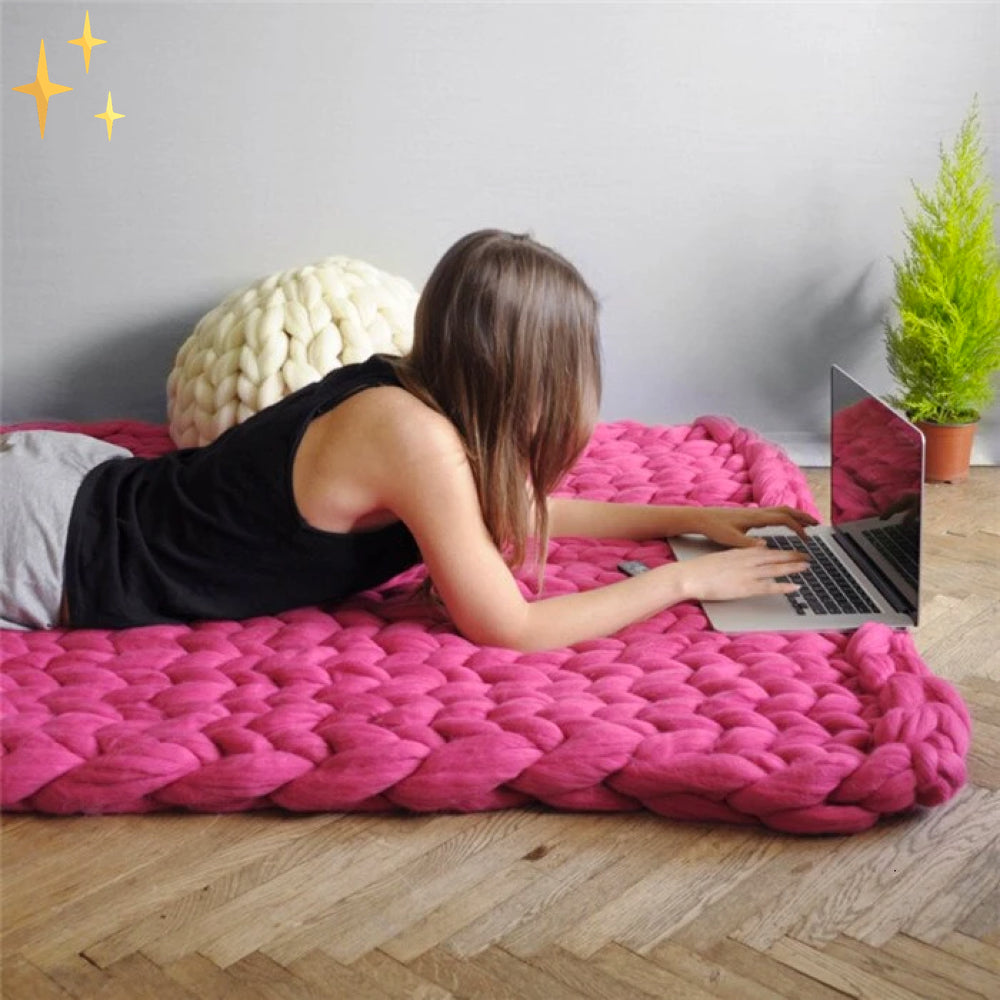 DIY crafting with super thick Wooluxe yarn, creating a warm, hand-knitted scarf.