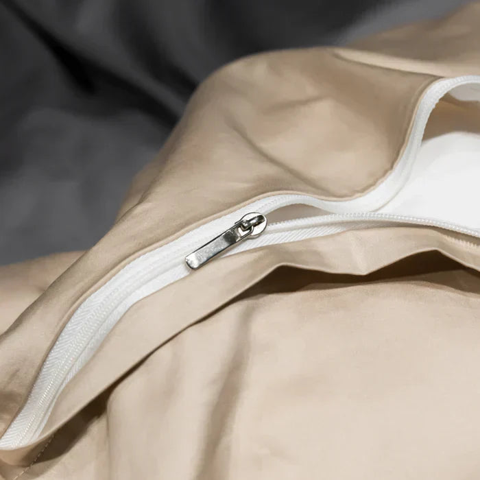 Breathable and soft satin cotton sheet set with delicate embroidery for a luxury bedroom.