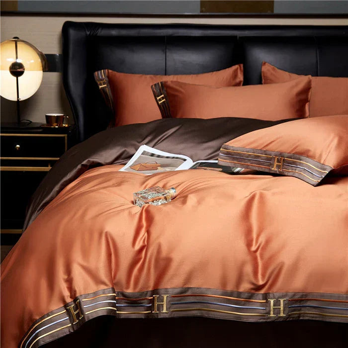 Pair of embroidered satin cotton pillowcases, enhancing luxury and bedroom decor.
