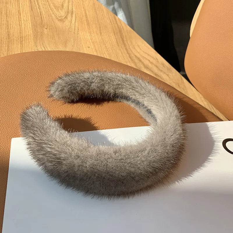 Soft faux fur women's headband, luxurious and warm winter accessory, cozy for cold weather comfort.